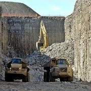 Two trucks carrying rocks in the Niagara tunnel projects